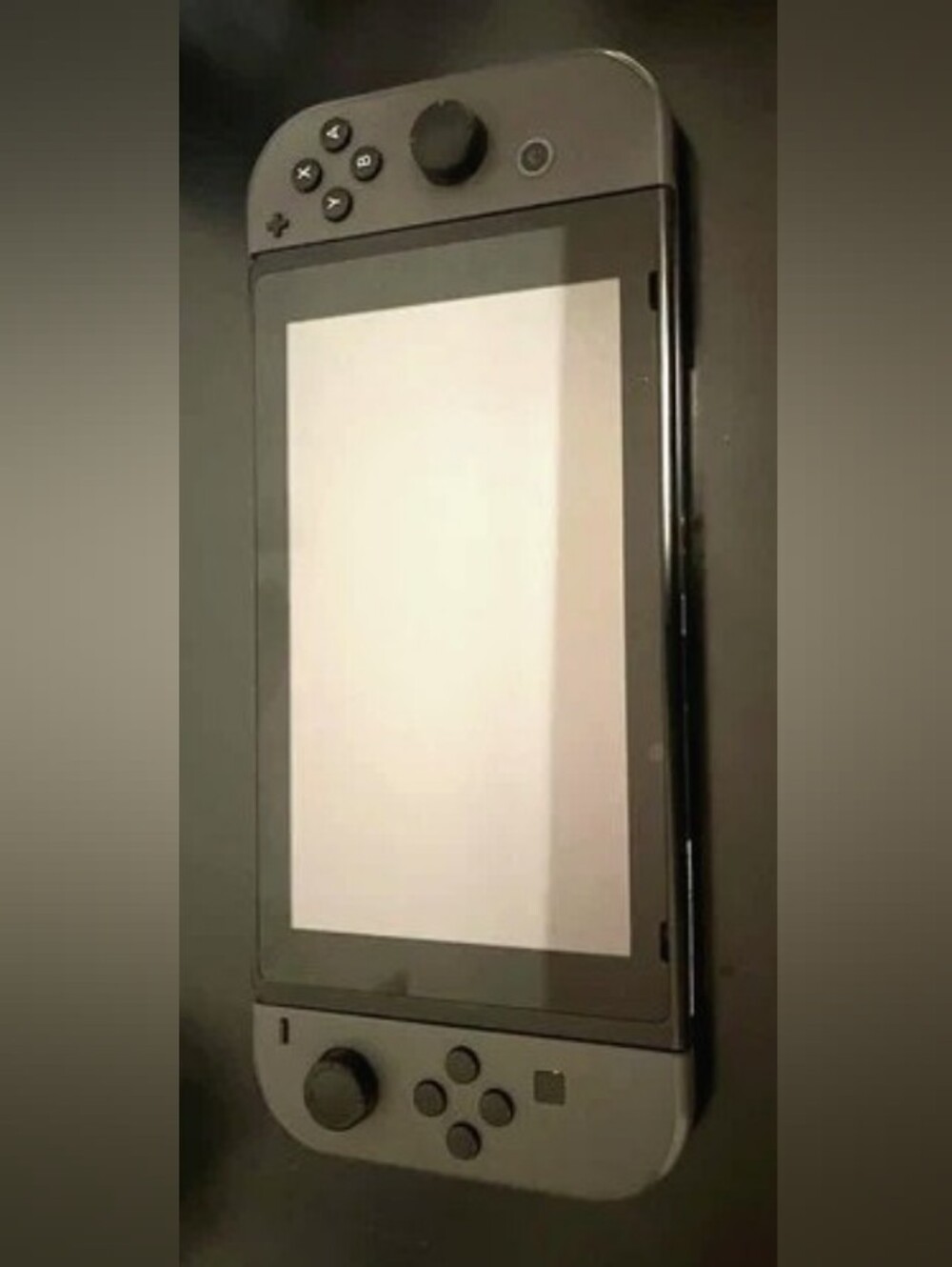 Nintendo Handheld Console with Gray Controllers
